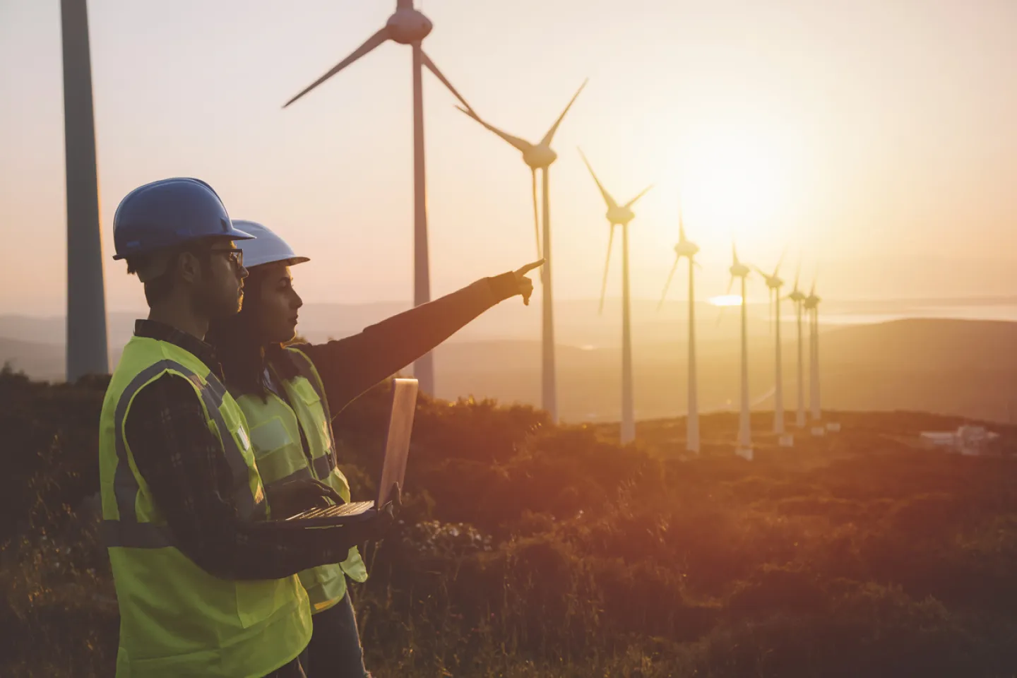 Two Engineers inspecting a wind farm